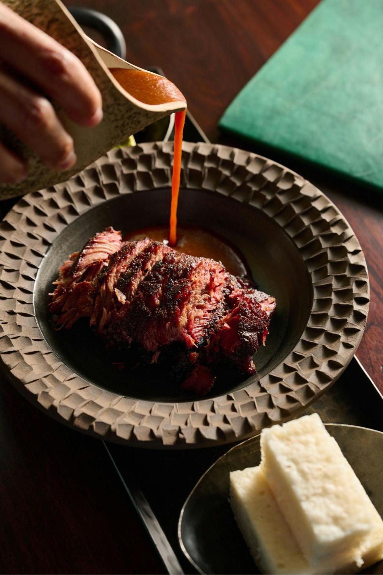 The Dubai Edition Exteriér fotografie A plate of grilled meat